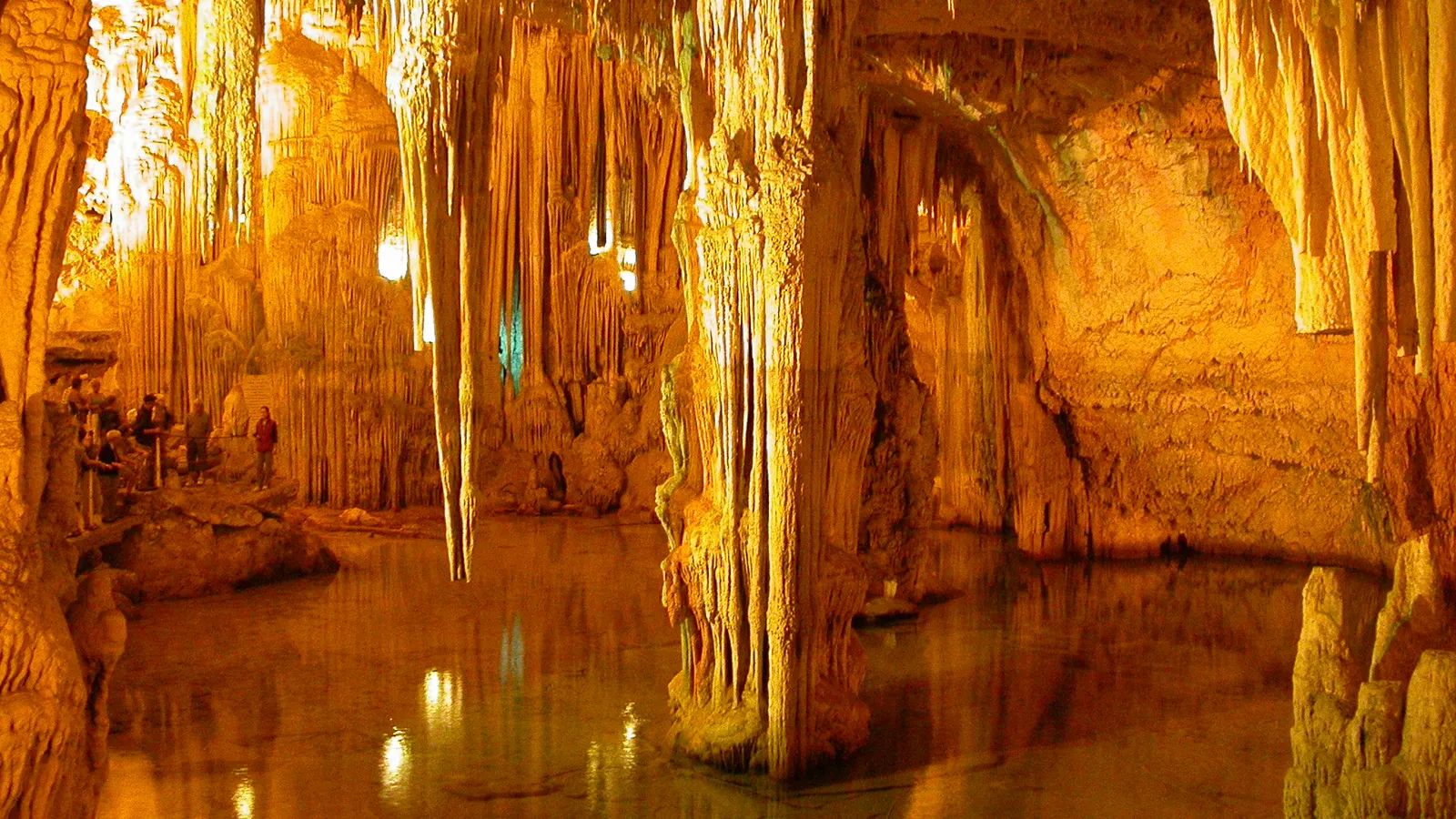 Stalactites and clear water in Neptune's Grotto below the cliffs of Capo Caccia, Sardinia