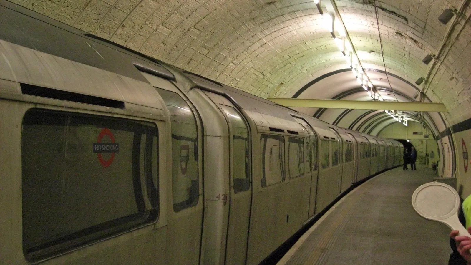 Disused platform of Aldwych tube station in London, an old train standing in the tunnel