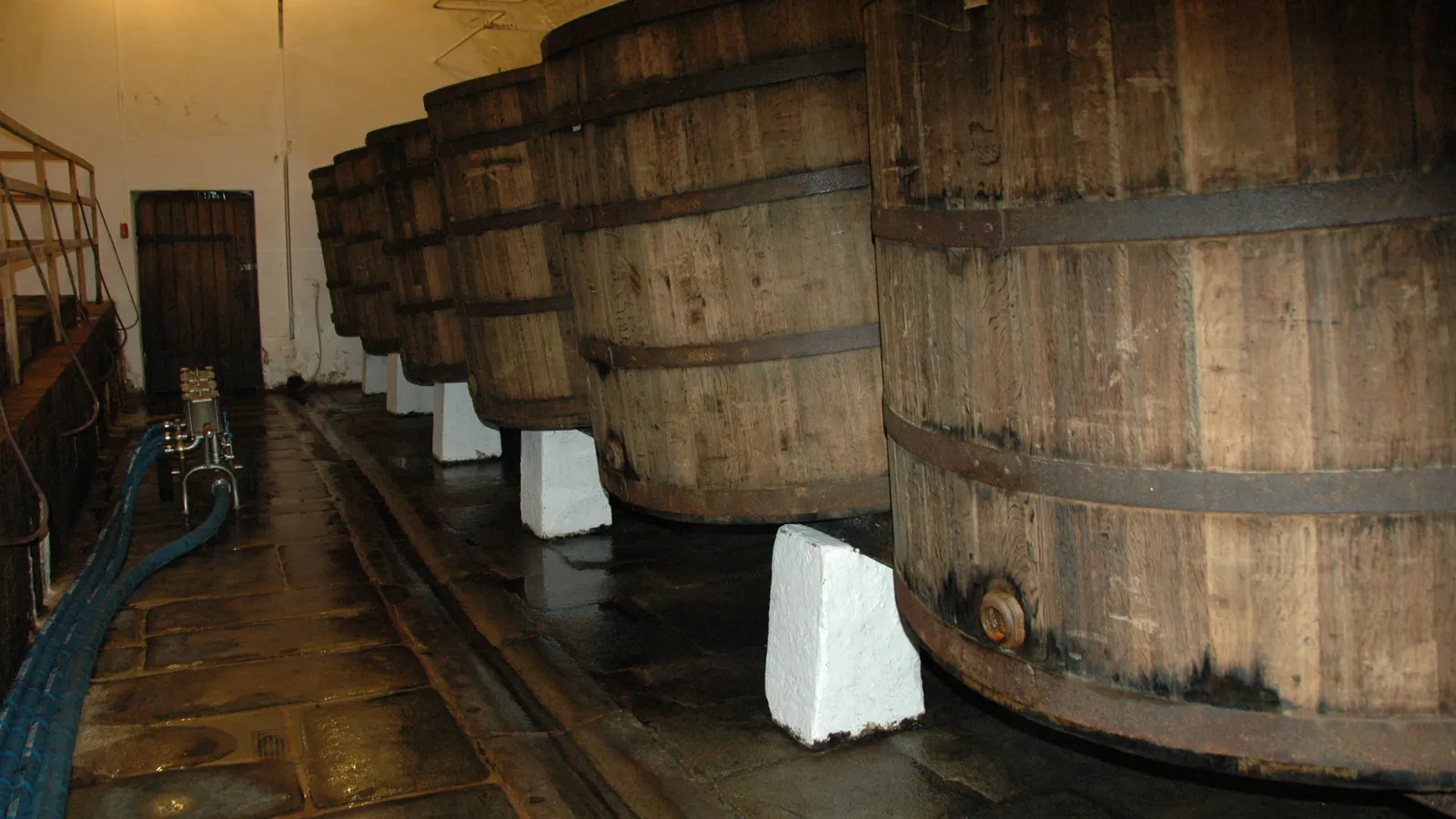 Wooden fermentation vessels in the historic cellars of the Pilsner Urquell brewery
