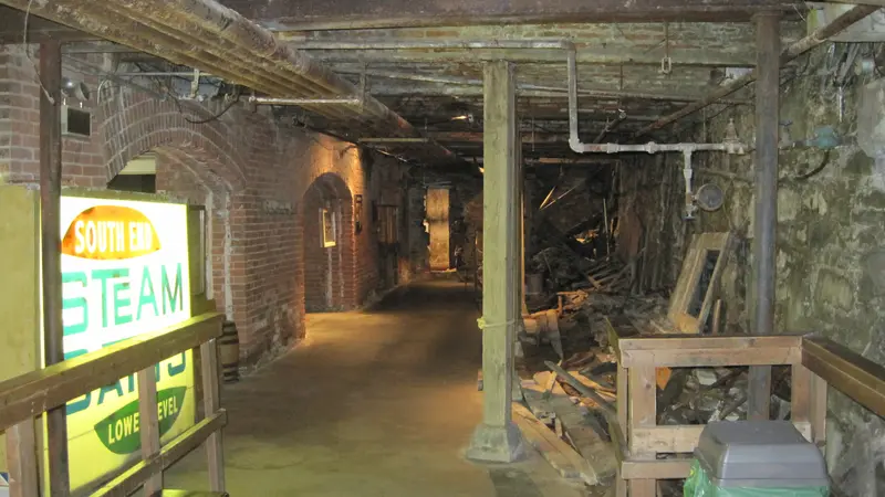 On the Seattle Underground tour: an old stretch of sidewalk below Pioneer Square, brick walls and posts